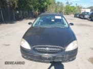 ✅ 2003 Ford Taurus • VIN: 1FAFP59S13A217651 • Lot: 43130709. Listed on IAAI with 148,062 mi. Free auction sales archive from the USA and detailed vehicle history report at DreamBid. Image 6.