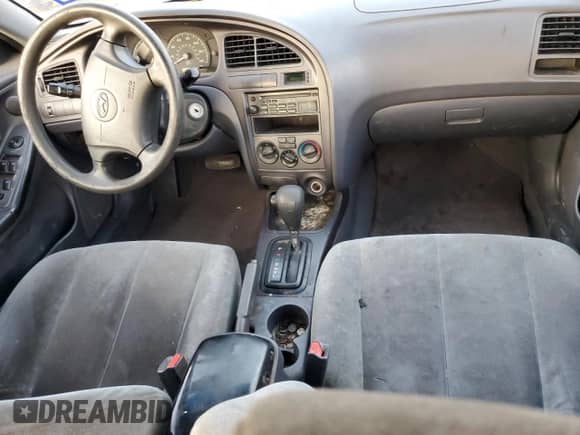 2003 Hyundai Elantra GLS z VIN KMHDN45D53U572664, wystawiony jako Copart lot #82387214 z przebiegiem Nie podano mil oraz Szkoda całkowita • Salvage title. Historia ofert i sprzedaży dostępna na DreamBid. Obrazek 8.