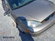 ✅ 2003 Ford Focus LX • VIN: 1FAFP33P63W324786 • Lot: 42693187. Wystawiony na IAAI z przebiegiem 128 597 mil. Bezpłatny archiwum sprzedaży aukcyjnych z USA i szczegółowy raport historii pojazdu na DreamBid. Zdjęcie 18.