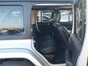 ✅ 2023 Jeep Wrangler Sahara • VIN: 1C4JJXP65PW630477 • Lot: 43864711. Listed on IAAI with 10,033 mi. Free auction sales archive from the USA and detailed vehicle history report at DreamBid. Image 8.