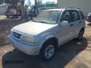 ✅ 1999 Suzuki Grand Vitara JLX • VIN: JS3TD62V3X4122207 • Lot: 42915554. Wystawiony na IAAI z przebiegiem 161 960 mil. Bezpłatny archiwum sprzedaży aukcyjnych z USA i szczegółowy raport historii pojazdu na DreamBid. Zdjęcie 2.
