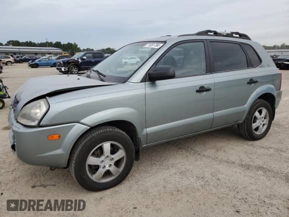 2006 Hyundai Tucson GL z VIN KM8JM72B26U292618, wystawiony jako Copart lot #71381784 z przebiegiem 208 371 mil mil oraz Szkoda całkowita • Salvage title. Historia ofert i sprzedaży dostępna na DreamBid. Obrazek 1.