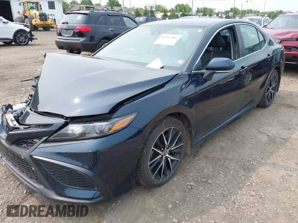 2021 Toyota Camry SE with VIN 4T1T11BKXMU020152, listed as a IAAI auction lot 42412484 with 39,274 mi miles and . Bid and sale history available at DreamBid. Image 2.