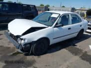 ✅ 1999 Toyota Corolla VE • VIN: 1NXBR12E5XZ199901 • Lot: 42769569. Listed on IAAI with 82,611 mi. Free auction sales archive from the USA and detailed vehicle history report at DreamBid. Image 2.