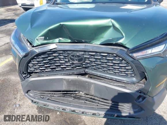 ✅ 2023 Toyota Corolla Cross LE • VIN: 7MUCAAAG3PV042624 • Lot: 42185430. Listed on IAAI with 28,039 mi. Free auction sales archive from the USA and detailed vehicle history report at DreamBid. Image 6.