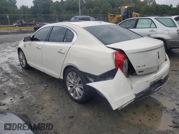 ✅ 2013 Lincoln MKS EcoBoost • VIN: 1LNHL9FTXDG609282 • Lot: 74070874. Listed on Copart with 149,094 mi. Free auction sales archive from the USA and detailed vehicle history report at DreamBid. Image 2.