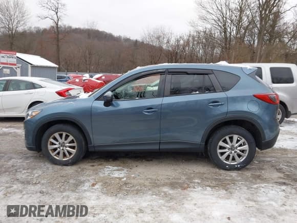 ✅ 2016 Mazda CX-5 Touring • VIN: JM3KE4CY6G0874938 • Lot: 43869585. Listed on IAAI with 180,000 mi. Free auction sales archive from the USA and detailed vehicle history report at DreamBid. Image 14.