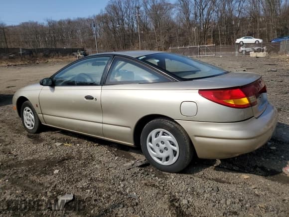 ✅ 1998 Saturn SC • VIN: 1G8ZE1289WZ126065 • Лот: 47439275. Опубликован ранее на Copart с пробегом 96 621 миль. Бесплатный доступ к архиву аукционных продаж из США и подробный отчёт об истории автомобиля на DreamBid. Изображение 2.