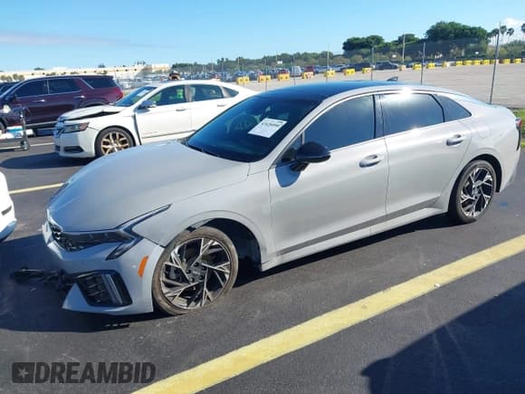 ✅ 2025 Kia K5 GT-Line • VIN: KNAG64J78S5319374 • Лот: 43426090. Опубликован ранее на IAAI с пробегом 22 092 миль. Бесплатный доступ к архиву аукционных продаж из США и подробный отчёт об истории автомобиля на DreamBid. Изображение 2.