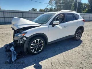 ✅ 2016 Mazda CX-5 Grand Touring • VIN: JM3KE4DY1G0669008 • Lot: 86889025. Wystawiony na Copart z przebiegiem Nie podano. Bezpłatny archiwum sprzedaży aukcyjnych z USA i szczegółowy raport historii pojazdu na DreamBid. Zdjęcie 1.