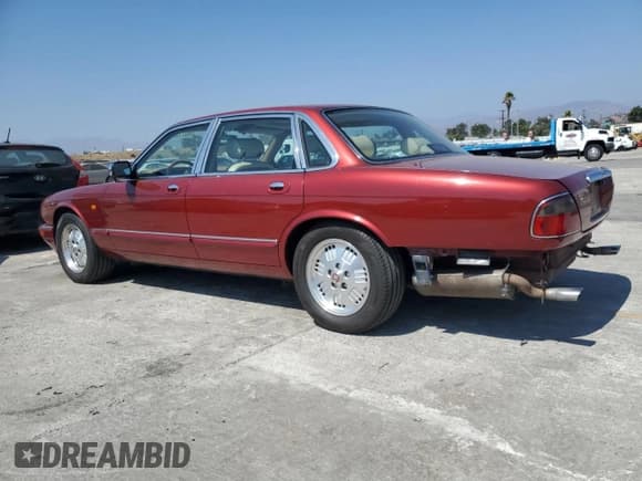 ✅ 1995 Jaguar XJ • VIN: SAJKX1744SC720830 • Lot: 69212295. Listed on Copart with 77,847 mi. Free auction sales archive from the USA and detailed vehicle history report at DreamBid. Image 2.