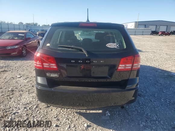 2013 Dodge Journey American Value with VIN 3C4PDCAB5DT597224, listed as a Copart auction lot 82536665 with 104,666 mi miles and Clean title. Bid and sale history available at DreamBid. Image 6.