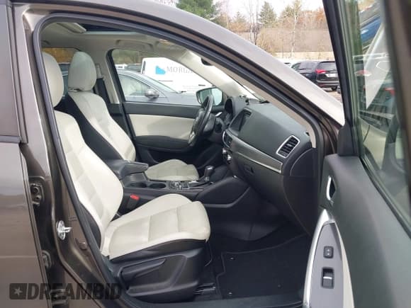 ✅ 2016 Mazda CX-5 Grand Touring • VIN: JM3KE4DY6G0672342 • Lot: 43581193. Wystawiony na IAAI z przebiegiem 94 680 mil. Bezpłatny archiwum sprzedaży aukcyjnych z USA i szczegółowy raport historii pojazdu na DreamBid. Zdjęcie 5.