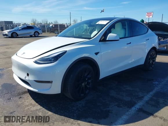 ✅ 2023 Tesla Model Y Long Range • VIN: 7SAYGDEE0PF945202 • Lot: 41611762. Listed on IAAI with 7,316 mi. Free auction sales archive from the USA and detailed vehicle history report at DreamBid. Image 2.