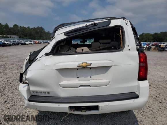 2019 Chevrolet Tahoe LS with VIN 1GNSCAKC9KR151048, listed as a Copart auction lot 69196595 with 100,702 mi miles and Salvage title. Bid and sale history available at DreamBid. Image 6.