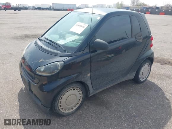 ✅ 2009 Smart fortwo Pure • VIN: WMEEJ31X59K312270 • Lot: 41910686. Listed on IAAI with 111,107 mi. Free auction sales archive from the USA and detailed vehicle history report at DreamBid. Image 2.