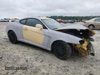 2004 Hyundai Tiburon GT с VIN KMHHN65F94U153085, выставлен на аукционе Copart как лот 65896785 с пробегом Не указан миль и Списание • Salvage title. История ставок и продаж доступна на DreamBid. Изображение 4.