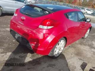 2012 Hyundai Veloster w/Red Int with VIN KMHTC6AD8CU065292, listed as a IAAI auction lot 43619012 with 156,498 mi miles and . Bid and sale history available at DreamBid. Image 4.