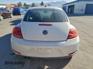 ✅ 2013 Volkswagen Beetle 2.5L • VIN: 3VWJX7AT2DM669016 • Lot: 94439545. Listed on Copart with 82,512 mi. Free auction sales archive from the USA and detailed vehicle history report at DreamBid. Image 6.