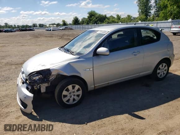 2010 Hyundai Accent L with VIN KMHCN3BCXAU182917, listed as a Copart auction lot 69464685 with 124,678 mi miles and Salvage title. Bid and sale history available at DreamBid. Image 1.