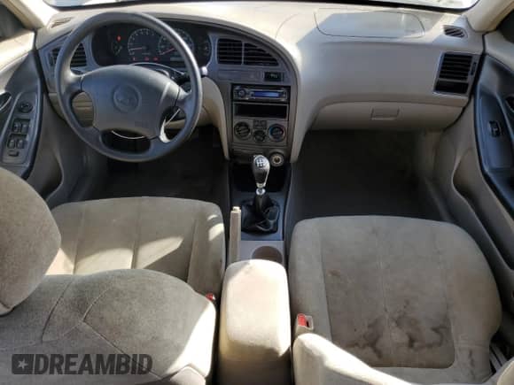 2002 Hyundai Elantra GLS z VIN KMHDN45D22U434479, wystawiony jako Copart lot #77869634 z przebiegiem 231 962 mil mil oraz Szkoda całkowita • Salvage title. Historia ofert i sprzedaży dostępna na DreamBid. Obrazek 8.