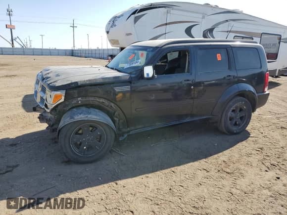 2008 Dodge Nitro SXT с VIN 1D8GU28K58W219907, выставлен на аукционе Copart как лот 77009104 с пробегом Не указан миль и Списание • Salvage title. История ставок и продаж доступна на DreamBid. Изображение 1.