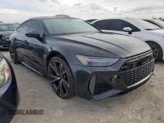 ✅ 2021 Audi RS 7 • VIN: WUAPCBF25MN907221 • Лот: 77997544. Опубликован ранее на Copart с пробегом 28 097 миль. Бесплатный доступ к архиву аукционных продаж из США и подробный отчёт об истории автомобиля на DreamBid. Изображение 4.