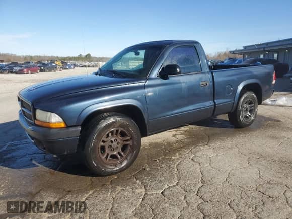 2002 Dodge Dakota Sport z VIN 1B7FL36X32S536309, wystawiony jako Copart lot #47187435 z przebiegiem 200 746 mil mil oraz Szkoda całkowita • Salvage title. Historia ofert i sprzedaży dostępna na DreamBid. Obrazek 1.