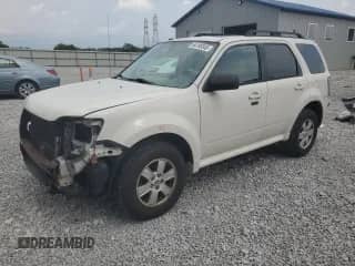 2011 Mercury Mariner с VIN 4M2CN8B71BKJ01749, выставлен на аукционе Copart как лот 64199345 с пробегом 157 001 миль миль и Списание • Salvage title. История ставок и продаж доступна на DreamBid. Изображение 1.