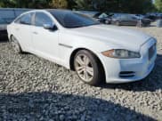 ✅ 2014 Jaguar XJ Portfolio • VIN: SAJWJ2GD9E8V67295 • Lot: 67207105. Listed on Copart with 121,936 mi. Free auction sales archive from the USA and detailed vehicle history report at DreamBid. Image 4.