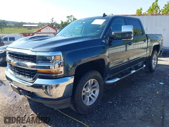 2018 Chevrolet Silverado 1500 LT z VIN 3GCUKREC4JG292008, wystawiony jako IAAI lot #43370209 z przebiegiem 96 545 mil mil oraz . Historia ofert i sprzedaży dostępna na DreamBid. Obrazek 2.