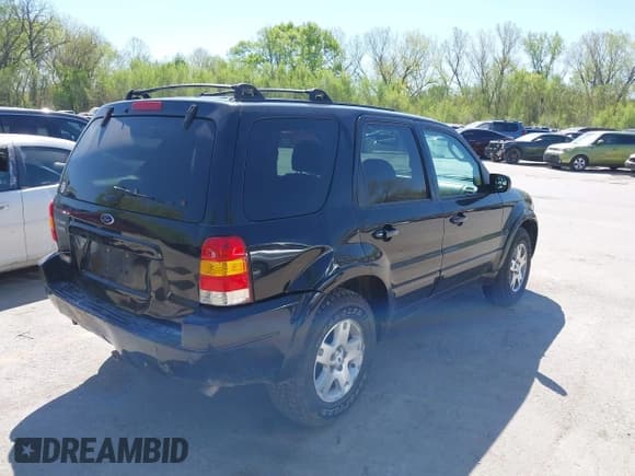 ✅ 2003 Ford Escape Limited • VIN: 1FMCU94103KB90251 • Lot: 42034006. Listed on IAAI with 225,566 mi. Free auction sales archive from the USA and detailed vehicle history report at DreamBid. Image 4.