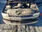 2001 Chevrolet Silverado 1500 LT z VIN 1GCEC19T11Z180375, wystawiony jako Copart lot #84170524 z przebiegiem 180 728 mil mil oraz Szkoda całkowita • Salvage title. Historia ofert i sprzedaży dostępna na DreamBid. Obrazek 11.