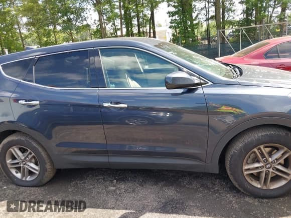 ✅ 2017 Hyundai Santa Fe 2.4L • VIN: 5XYZTDLB9HG441313 • Lot: 42742060. Listed on IAAI with 68,089 mi. Free auction sales archive from the USA and detailed vehicle history report at DreamBid. Image 13.