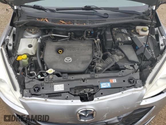 ✅ 2012 Mazda 5 Grand Touring • VIN: JM1CW2DL8C0136697 • Лот: 82244835. Опубликован ранее на Copart с пробегом 44 384 миль. Бесплатный доступ к архиву аукционных продаж из США и подробный отчёт об истории автомобиля на DreamBid. Изображение 11.