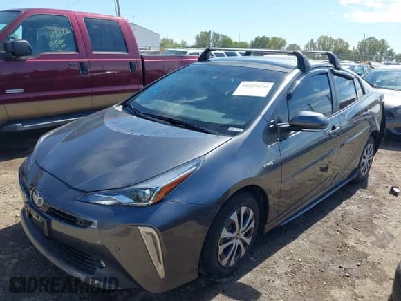 2022 Toyota Prius LE with VIN JTDL9MFU2N3034161, listed as a IAAI auction lot 40359290 with 62,451 mi miles and . Bid and sale history available at DreamBid. Image 2.