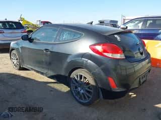 2013 Hyundai Veloster w/Gray Int z VIN KMHTC6ADXDU108497, wystawiony jako IAAI lot #43408721 z przebiegiem 100 974 mil mil oraz . Historia ofert i sprzedaży dostępna na DreamBid. Obrazek 3.