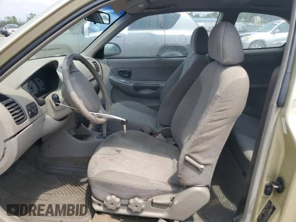 2001 Hyundai Accent GS z VIN KMHCG35C91U126523, wystawiony jako Copart lot #59768915 z przebiegiem 211 198 mil mil oraz Szkoda całkowita • Salvage title. Historia ofert i sprzedaży dostępna na DreamBid. Obrazek 7.