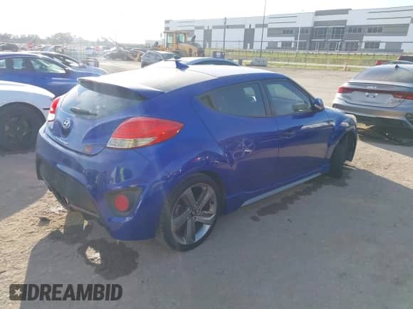 2014 Hyundai Veloster Turbo z VIN KMHTC6AE4EU184467, wystawiony jako IAAI lot #43457856 z przebiegiem 149 546 mil mil oraz . Historia ofert i sprzedaży dostępna na DreamBid. Obrazek 4.