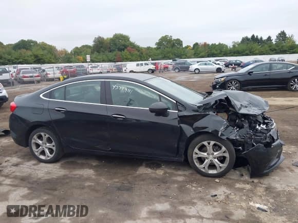 ✅ 2018 Chevrolet Cruze Premier • VIN: 1G1BF5SM1J7141701 • Lot: 43449111. Listed on IAAI with 128,825 mi. Free auction sales archive from the USA and detailed vehicle history report at DreamBid. Image 14.