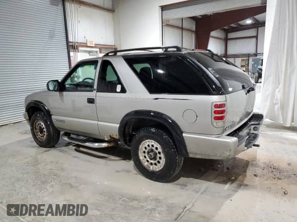 2000 Chevrolet Blazer LS z VIN 1GNCT18W9YK188091, wystawiony jako Copart lot #78592844 z przebiegiem 69 497 mil mil oraz Szkoda całkowita • Salvage title. Historia ofert i sprzedaży dostępna na DreamBid. Obrazek 2.