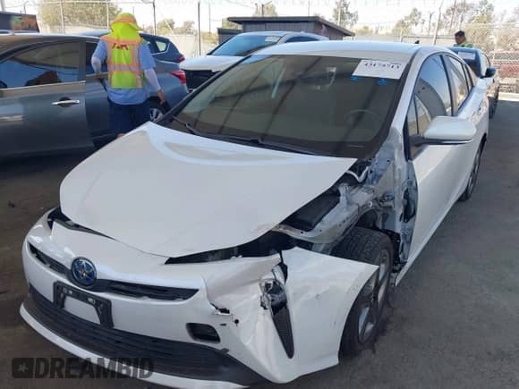 2021 Toyota Prius L Eco with VIN JTDKAMFU4M3134943, listed as a IAAI auction lot 43175713 with 106,611 mi miles and . Bid and sale history available at DreamBid. Image 2.