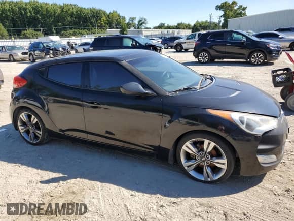 2012 Hyundai Veloster w/Red Int z VIN KMHTC6AD2CU041098, wystawiony jako Copart lot #71175754 z przebiegiem 131 908 mil mil oraz Czysty tytuł • Clean title. Historia ofert i sprzedaży dostępna na DreamBid. Obrazek 4.