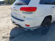 ✅ 2014 Jeep Grand Cherokee Summit • VIN: 1C4RJFJG9EC476126 • Lot: 43468707. Listed on IAAI with 143,755 mi. Free auction sales archive from the USA and detailed vehicle history report at DreamBid. Image 18.