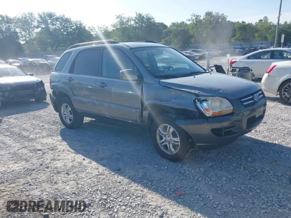 ✅ 2006 Kia Sportage LX • VIN: KNDJF723267292673 • Lot: 42705097. Wystawiony na IAAI z przebiegiem 99 258 mil. Bezpłatny archiwum sprzedaży aukcyjnych z USA i szczegółowy raport historii pojazdu na DreamBid. Zdjęcie 1.