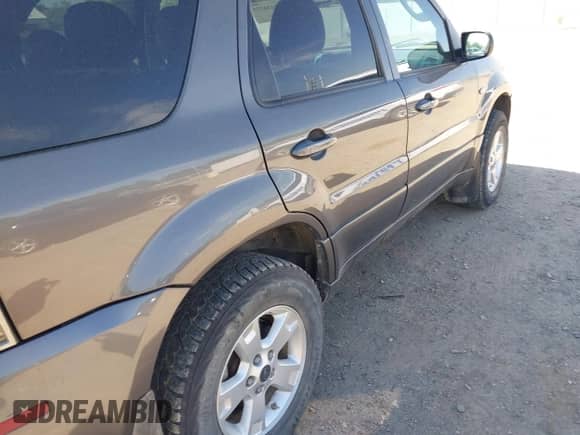 2006 Mercury Mariner Luxury с VIN 4M2CU57116KJ19454, выставлен на аукционе IAAI как лот 42436725 с пробегом 244 689 миль миль и . История ставок и продаж доступна на DreamBid. Изображение 13.