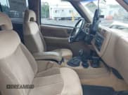 ✅ 1997 GMC Jimmy SLT • VIN: 1GKDT13WXV2569372 • Lot: 42667097. Listed on IAAI with 149,076 mi. Free auction sales archive from the USA and detailed vehicle history report at DreamBid. Image 5.