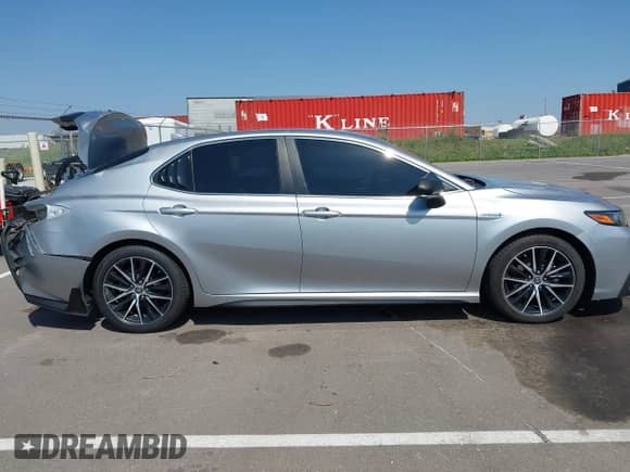 2021 Toyota Camry Hybrid SE z VIN 4T1G31AKXMU562641, wystawiony jako IAAI lot #42415712 z przebiegiem 71 085 mil mil oraz . Historia ofert i sprzedaży dostępna na DreamBid. Obrazek 13.