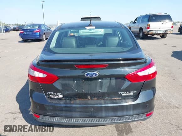 ✅ 2014 Ford Focus Titanium • VIN: 1FADP3J23EL237429 • Lot: 43358765. Listed on IAAI with 138,960 mi. Free auction sales archive from the USA and detailed vehicle history report at DreamBid. Image 16.
