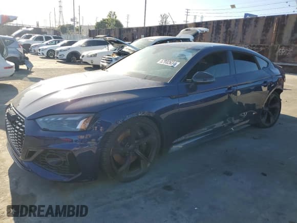 ✅ 2022 Audi RS 5 Sportback • VIN: WUAAWCF53NA902055 • Lot: 52702634. Listed on Copart with 25,128 mi. Free auction sales archive from the USA and detailed vehicle history report at DreamBid. Image 1.